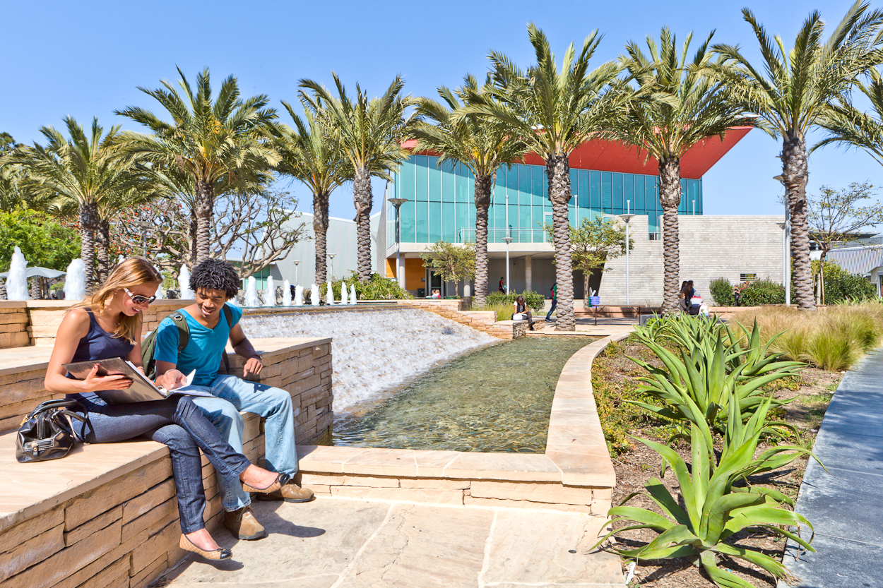 Santa Monica College students sitting and enjoying the weather while reading