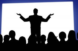 Person making speech in front of audience