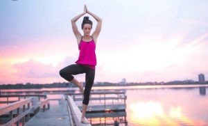 An image of a woman doing a yoga pose.