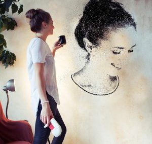A lady drew herself on a wall using spray paint