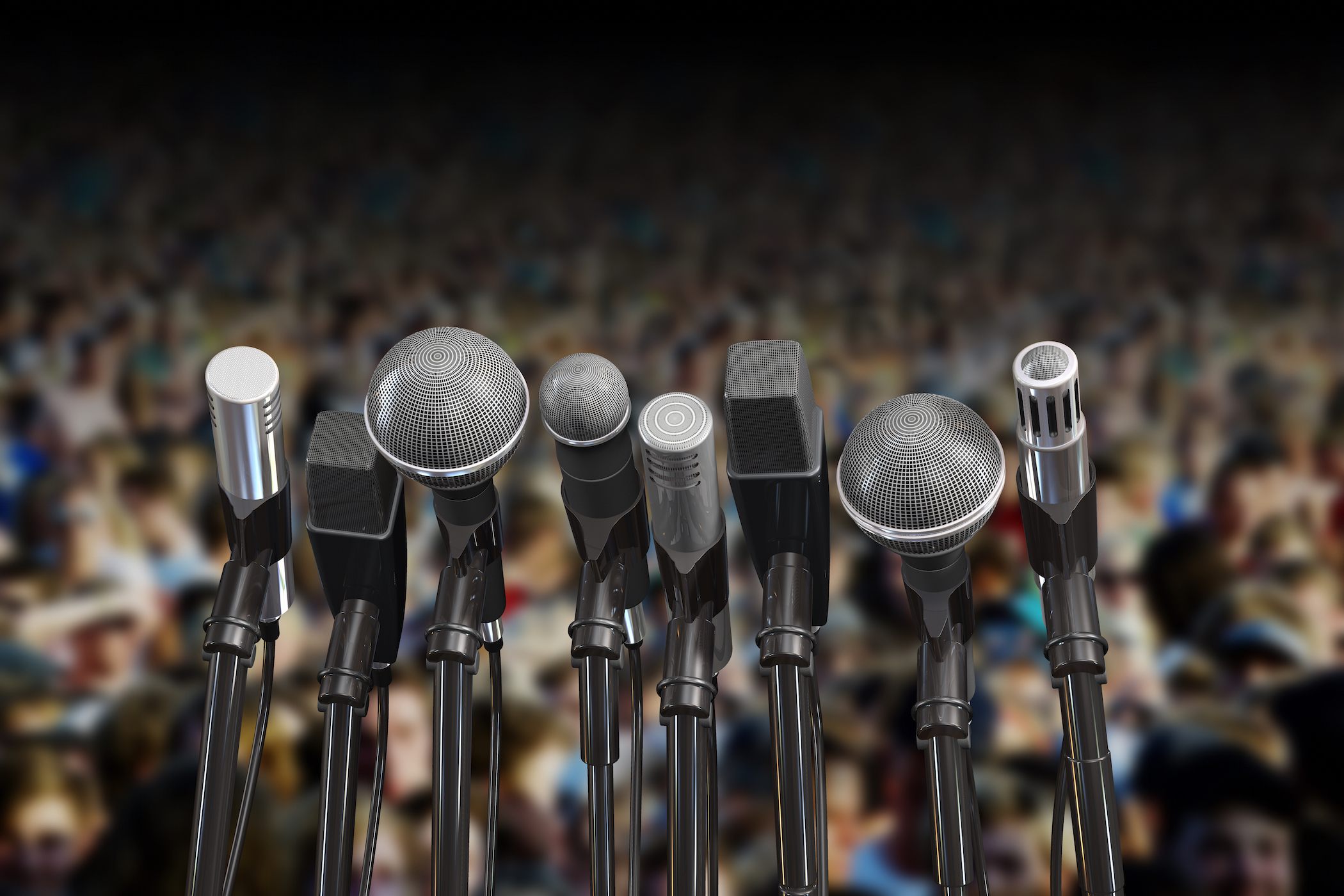 Microphones at a public speaking event.