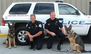 Police officers photograph with their K9