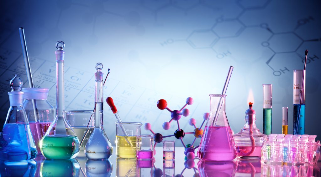 Glassware and chemicals used in chemistry labs.