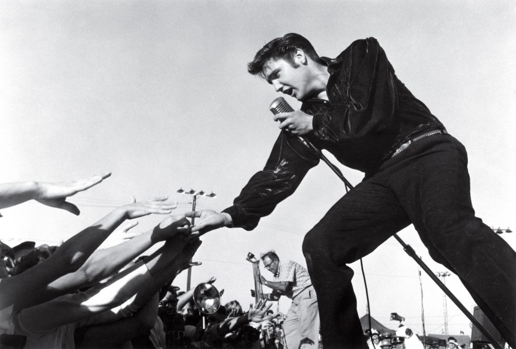 The King of Rock and Roll, Elvis Presley, performing.