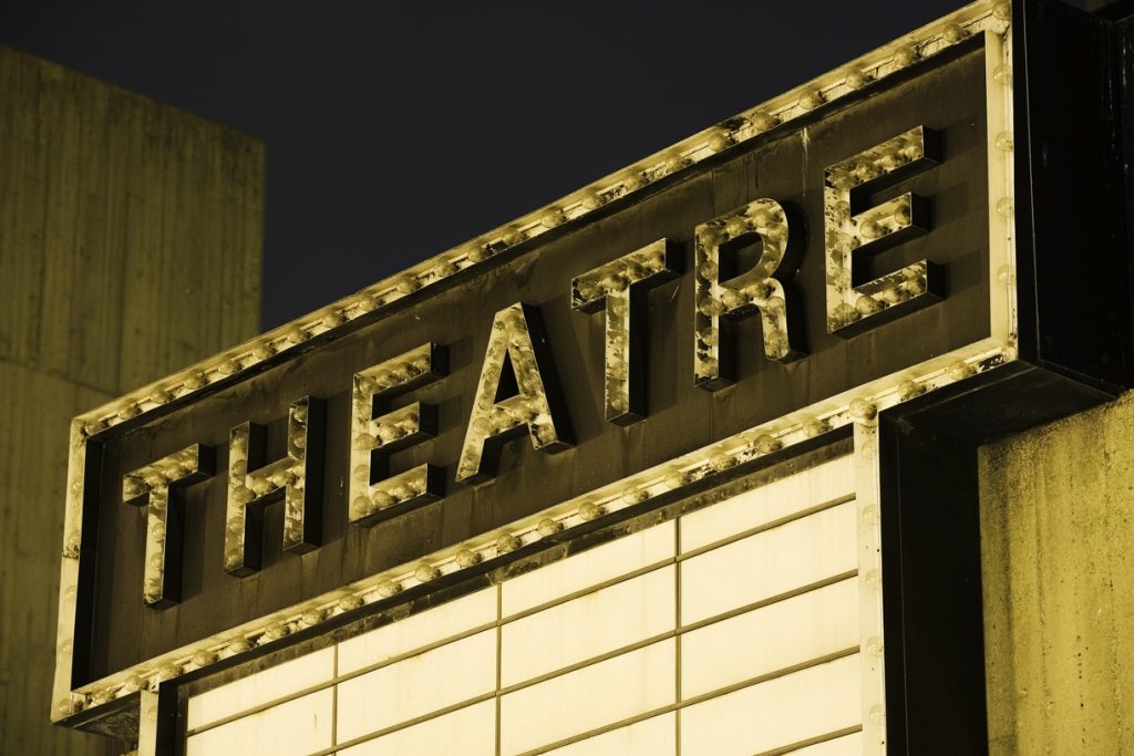 The sign outside of a theatre.