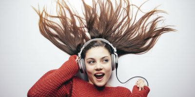 Woman listening to music on her headphones