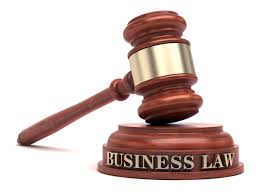 A judge's hammer written "Business Law"