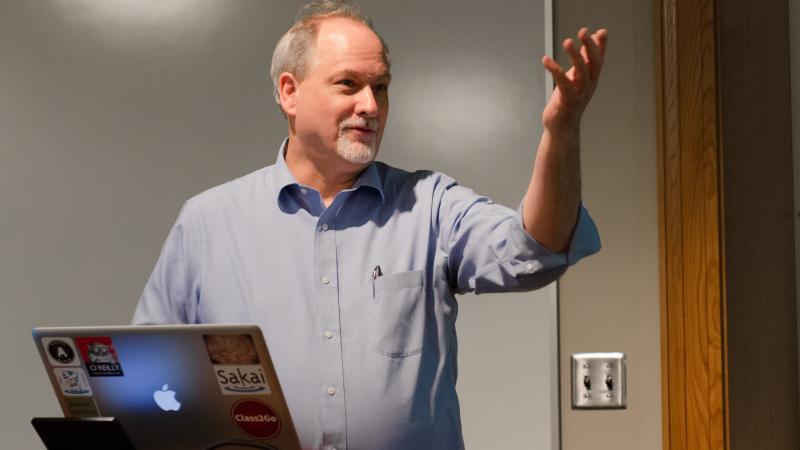 This image shows Professor Severance speaking in front of a class.