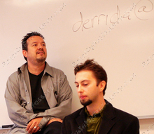 This image shows Professor Nericcio working with a student in his classroom.