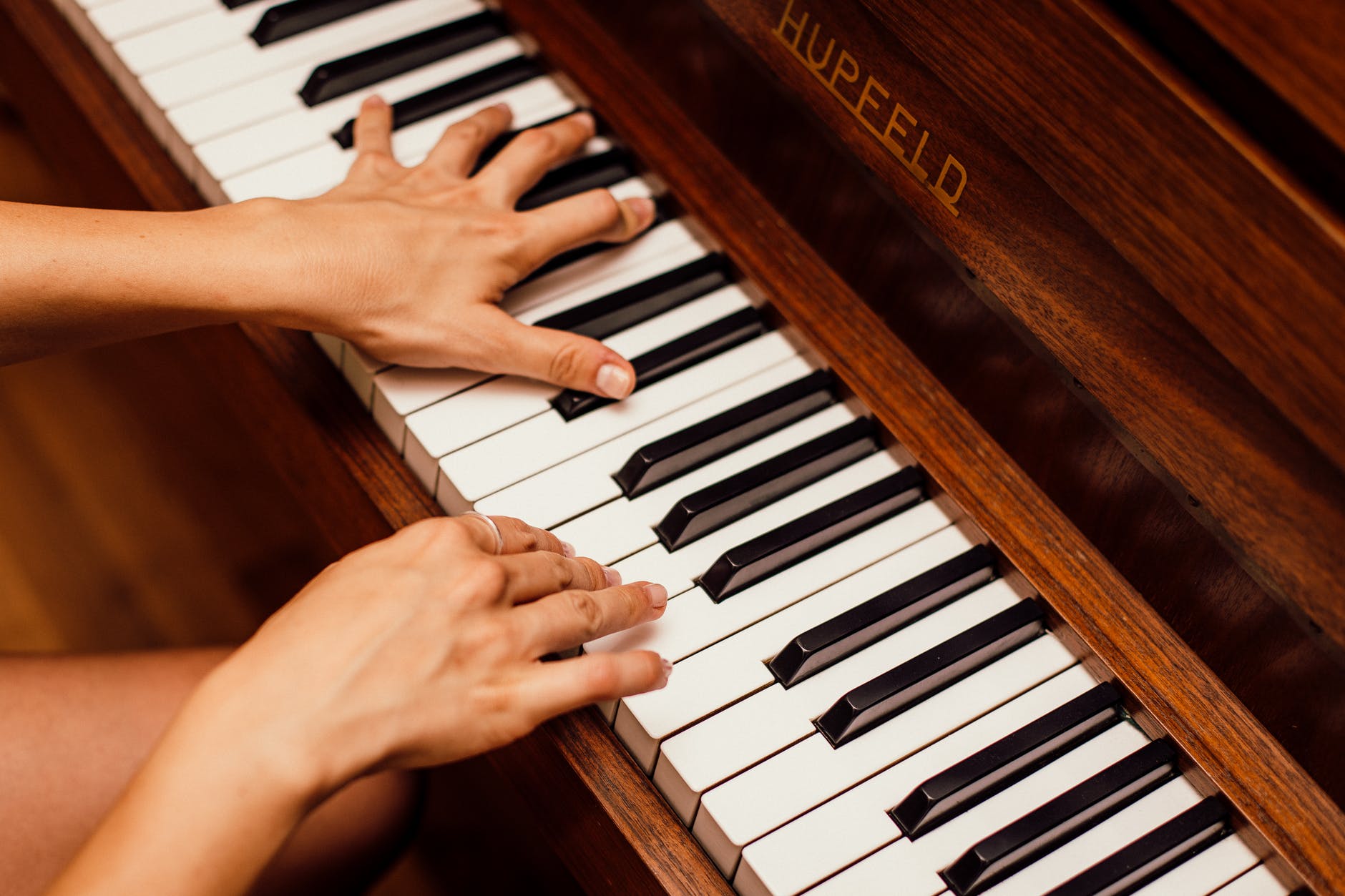 a woman playing the piano