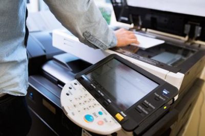 Man printing in the library