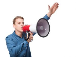 A person saying something with a bullhorn
