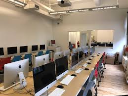 A room full of computers. There are no computer users around.