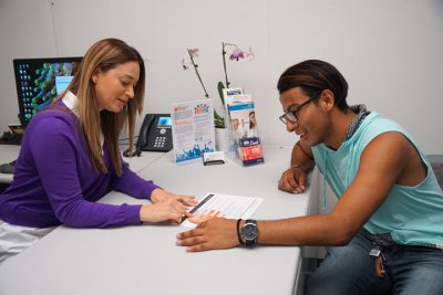 Student talking with his academic advisor