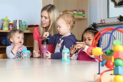 A child care specialists teaching children
