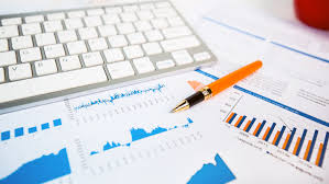 Pens, computer, and charts