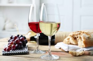 Wine glasses with grapes and bread