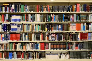 Different types of books on a library shelf