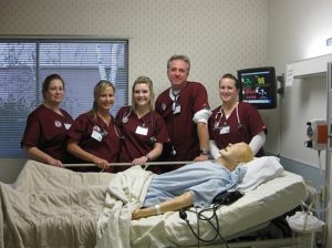 The image shows students in Nursing department of the University. Nursing offers innovative programs geared specifically to the needs of our local community
