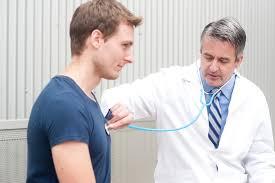 Doctor checking the patient through a stethoscope