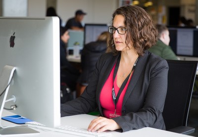 A student working as a programming assistant in the Digital Skills for the University of Calgary Youth Program