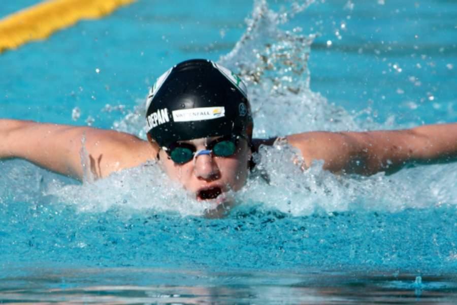 The student is swimming in the pool
