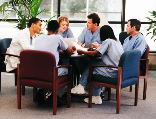 A group of students sitting around round table