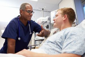 Male student talking to a nurse