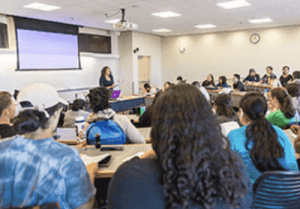 Students in class listening to professor