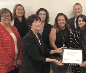 Faculty and staff of UC-Merced receving certificate