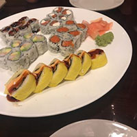 Serving of different types of Sushi in plate