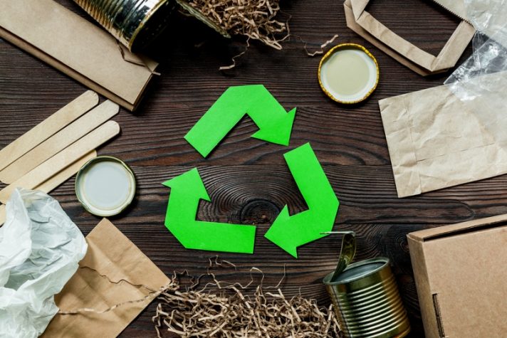 image of recycling logo with recyclables around it. showing what can be recycled