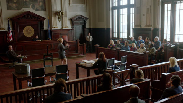 People hearing case inside court