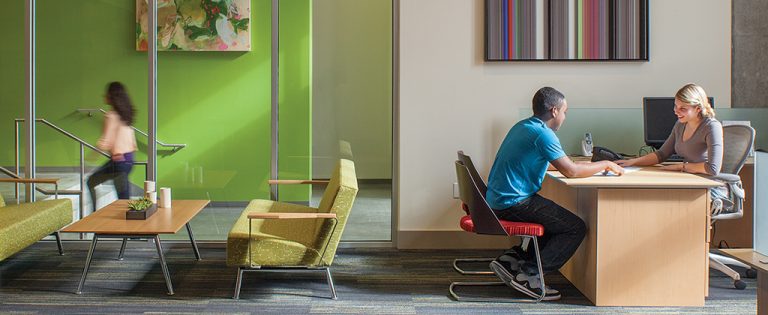 A Student Housing Leasing Manager attending to a student.