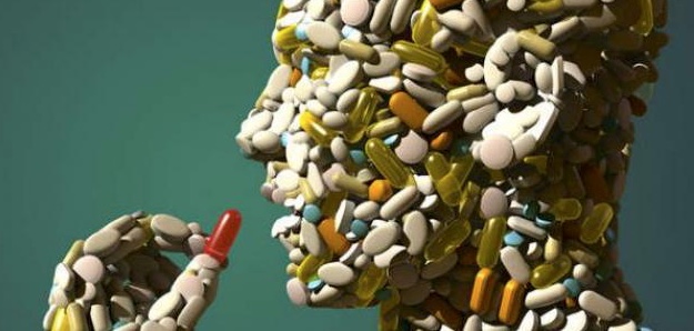 picture of someone taking a pill, with his face made out of pills