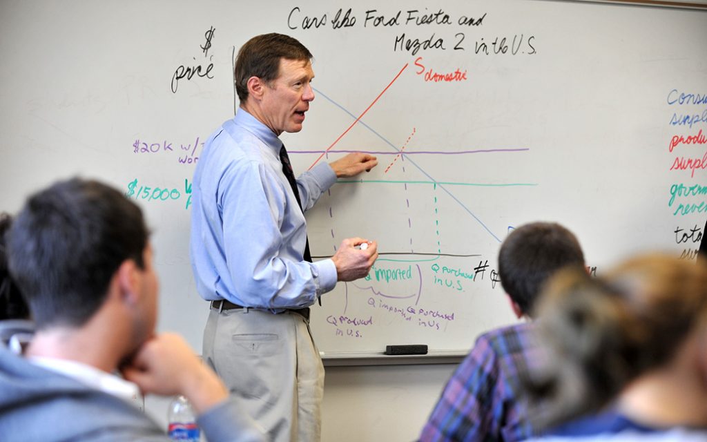 Professor teaching students in a classroom. 