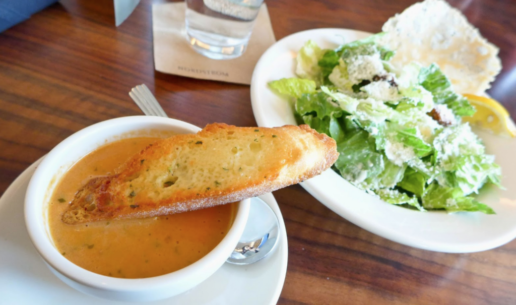 bread stick in soup with a salad at Bazille