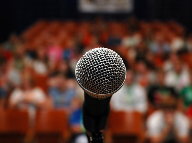 a microphone in front of a crowd of people