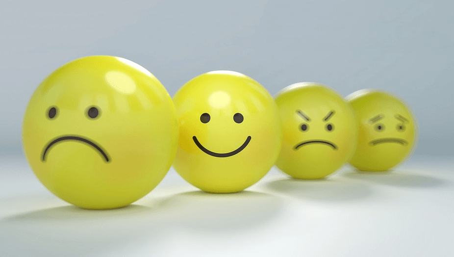 idea of human behavior as shown in balls, including different emotions like sad, happy, angry and worried