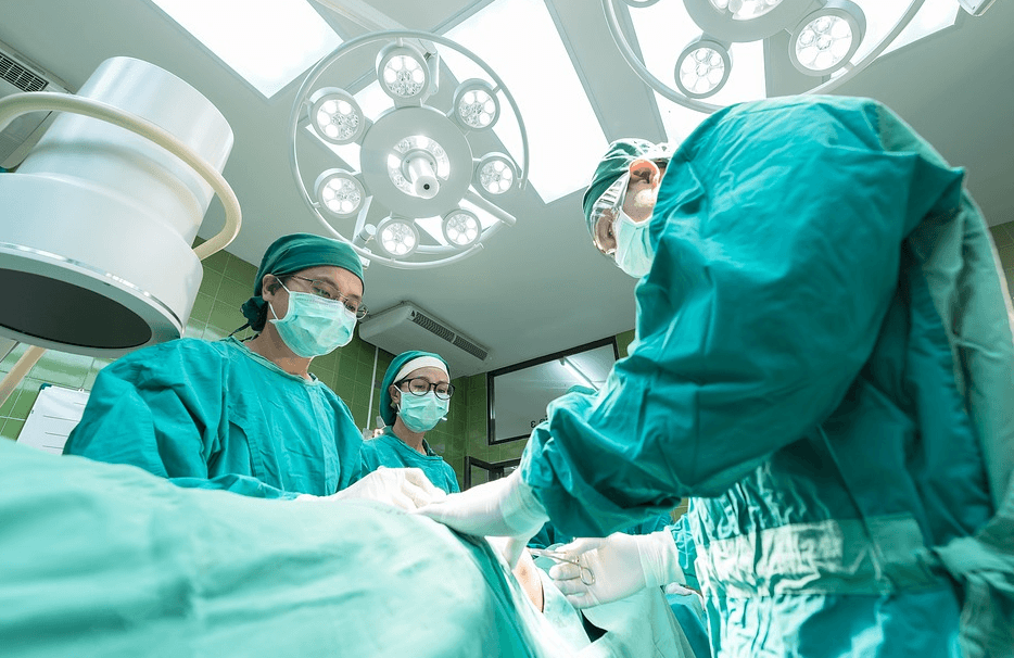 doctors and nurses performing surgery