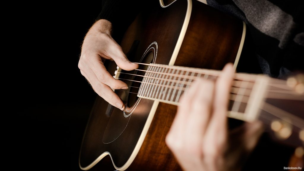 A person playing a guitar
