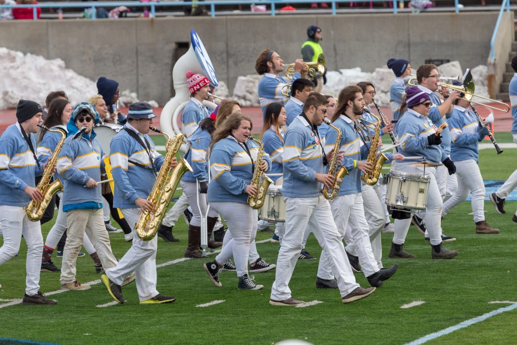 A matching band playing different instruments