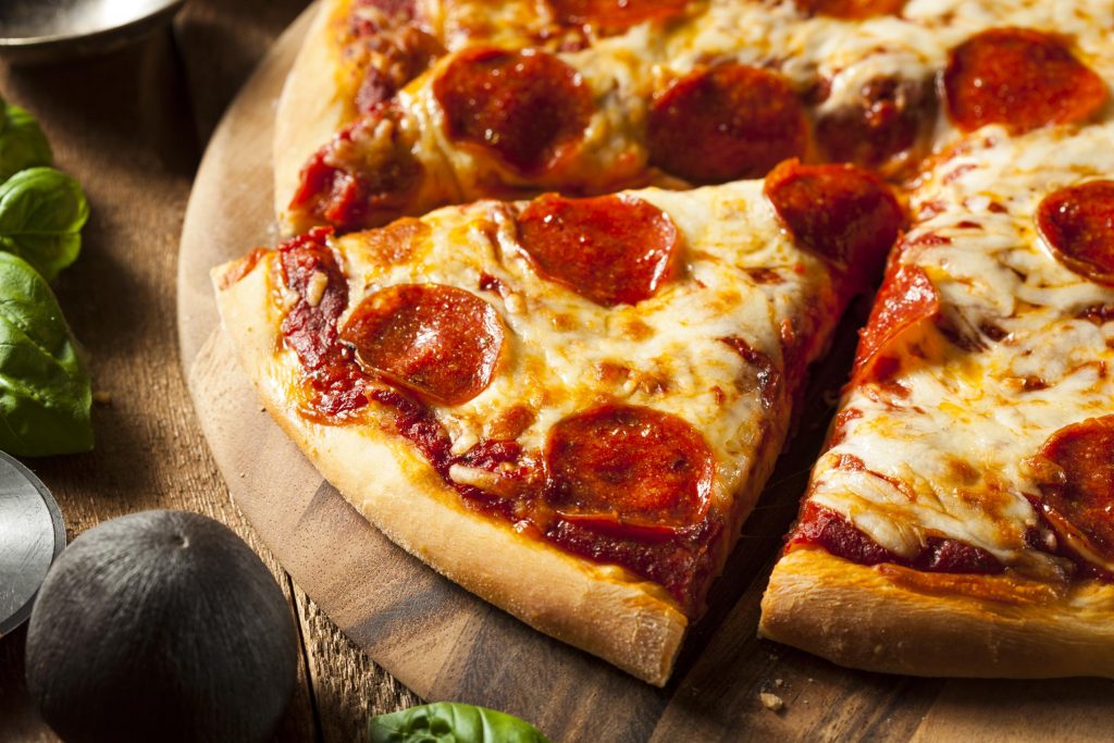 fresh pizza on a wooden table