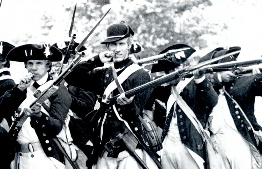 Ancient soldiers wielding riffles in a black and white picture