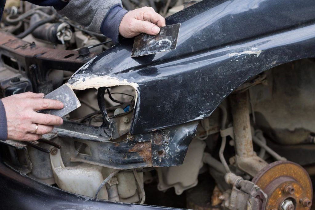 A damaged car being reparied