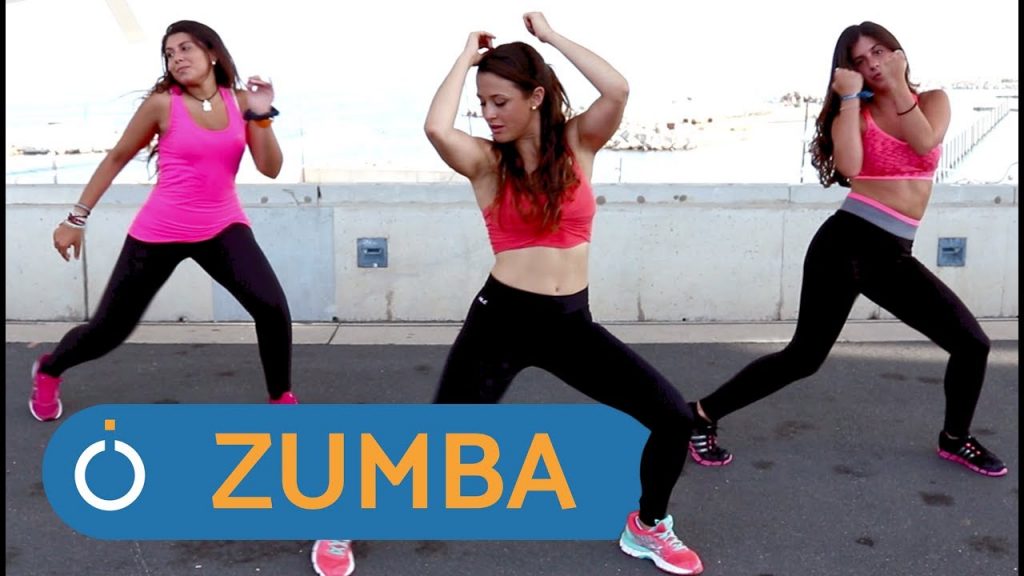 Three zumba dancers performing a routine