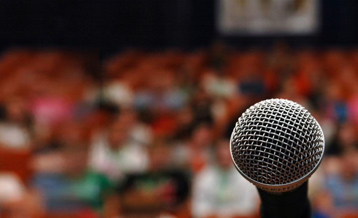 A microphone in front of an audience