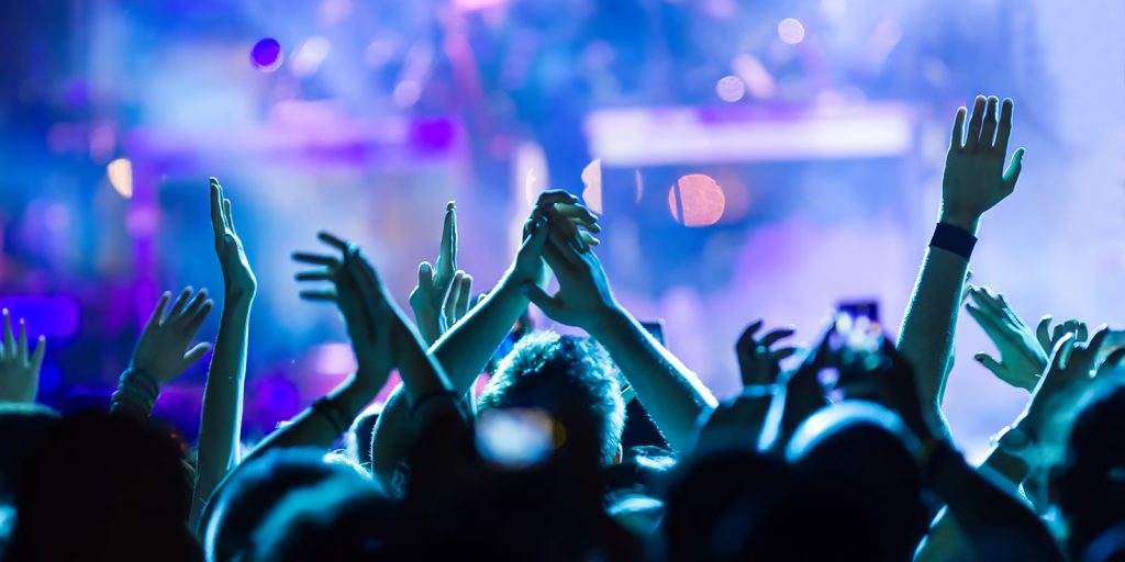 group of students at a concert enjoying a show