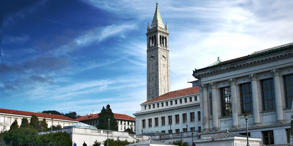 uc berkeley campus with their main tower in the center of the picture.