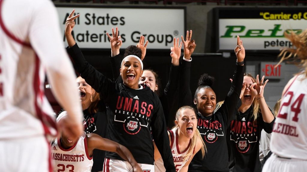 The UMass female basketball players cheering